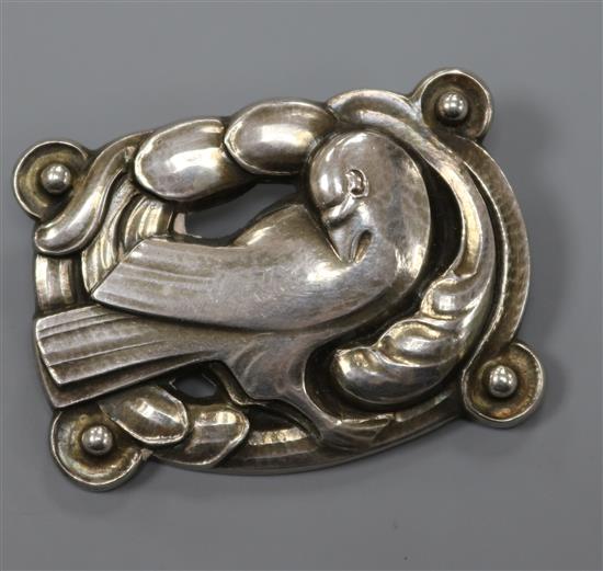 A Danish Georg Jensen sterling silver shaped rectangular stylised dove amid scrolls brooch, no. 209, 43mm.